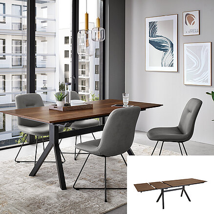 Modern dining room featuring a wooden table with metal legs, four grey upholstered chairs, chic pendant lights, and abstract wall art in a bright apartment.