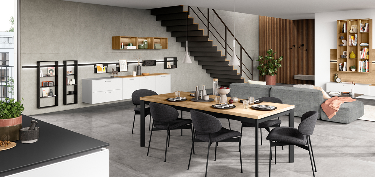 Moderne, geräumige Küche mit elegantem Design, Essbereich, hochmodernen Geräten und minimalistischen Möbeln vor einem Hintergrund neutraler Töne.