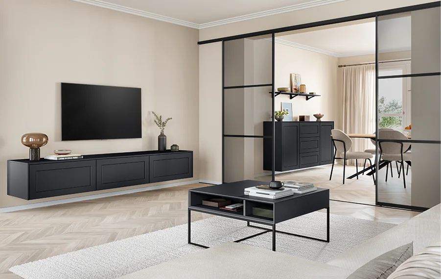 Vorwandgleittüren in Schwarz mit Grauglas als stillvoller Raumteiler zwischen Wohn- und Essbereich